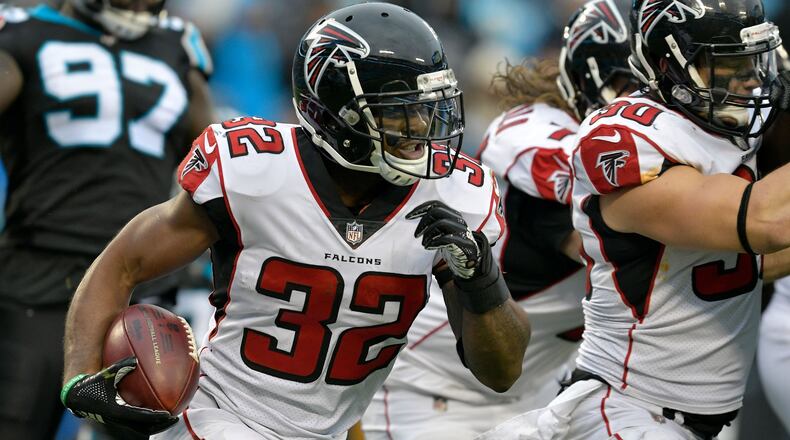 Falcons running back Brian Hill runs the ball against the Carolina Panthers in the fourth quarter Sunday, Dec. 23, 2018, at Bank of America Stadium in Charlotte, N.C.