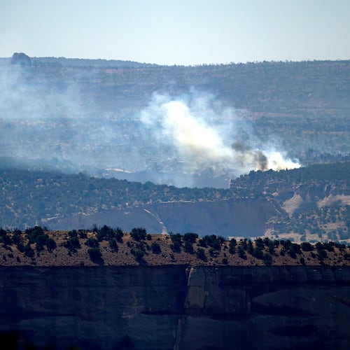 Smoke rises from the Snyder Fire burning near Thompson Springs, Utah, on Sunday, June 28, 2026. (AP Photo/Noah Berger)