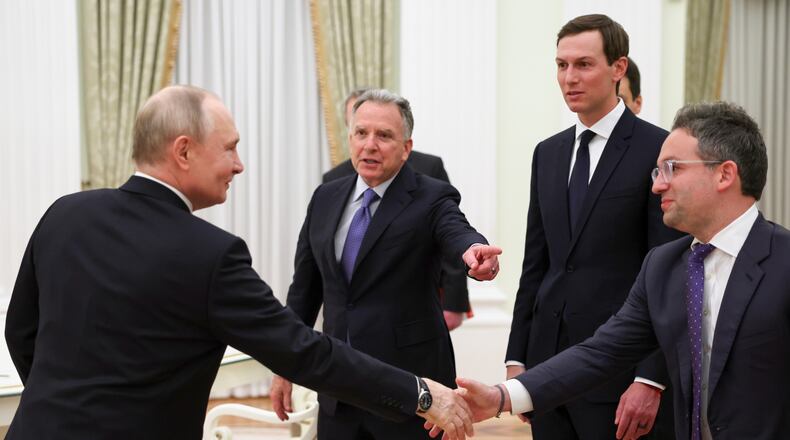 Russian President Vladimir Putin, left, greet U.S. President Donald Trump's envoys Steve Witkoff, centre left, Jared Kushner, second right, and Josh Gruenbaum, the head of the Federal Acquisition Service at the General Services Administration, at the Senate Palace of the Kremlin, in Moscow, Thursday, Jan. 22, 2026. (Alexander Kazakov/Sputnik, Kremlin Pool Photo via AP)