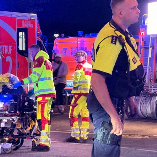 Emergency personnel tend to a person on a stretcher following the cancellation of Christopher Street Day in Berlin on Saturday, July 25, 2026. (Andreas Rabenstein/dpa via AP)