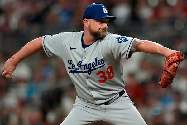Los Angeles Dodgers pitcher Kirby Yates (38) delivers against the Atlanta Braves in the seventh inning of a baseball game, Friday, May 2, 2025, in Atlanta. (AP Photo/Mike Stewart)