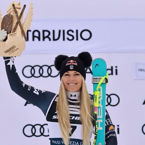 United States' Lindsey Vonn celebrates on the podium after taking second place in an alpine ski, women's World Cup Super G, in Tarvisio, Italy, Sunday, Jan. 18, 2026. (AP Photo/Marco Trovati)