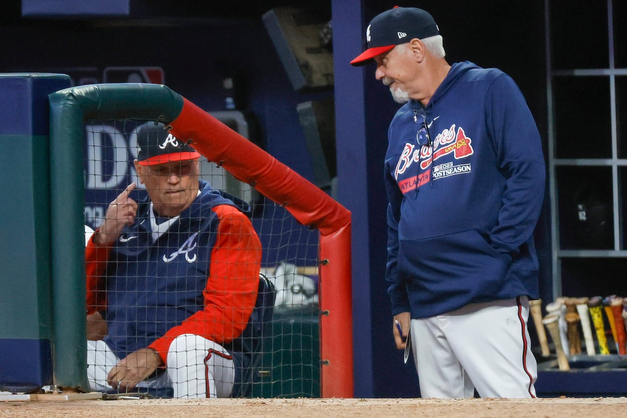 Atlanta Braves manager Brian Snitker and pitching coach Rick Kranitz confer during the fourth inning of NLDS Game 2 against the Philadelphia Phillies in Atlanta on Monday, Oct. 9, 2023. (Miguel Martinez/AJC)