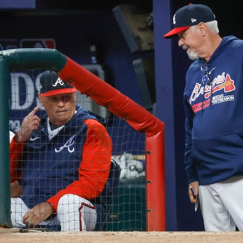 Atlanta Braves manager Brian Snitker and pitching coach Rick Kranitz confer during the fourth inning of NLDS Game 2 against the Philadelphia Phillies in Atlanta on Monday, Oct. 9, 2023. (Miguel Martinez/AJC)