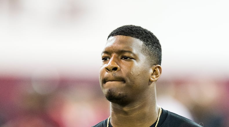 Jameis Winston walks between drills during Florida State football pro day in Tallahassee, Fla., Tuesday, March 31, 2015.
