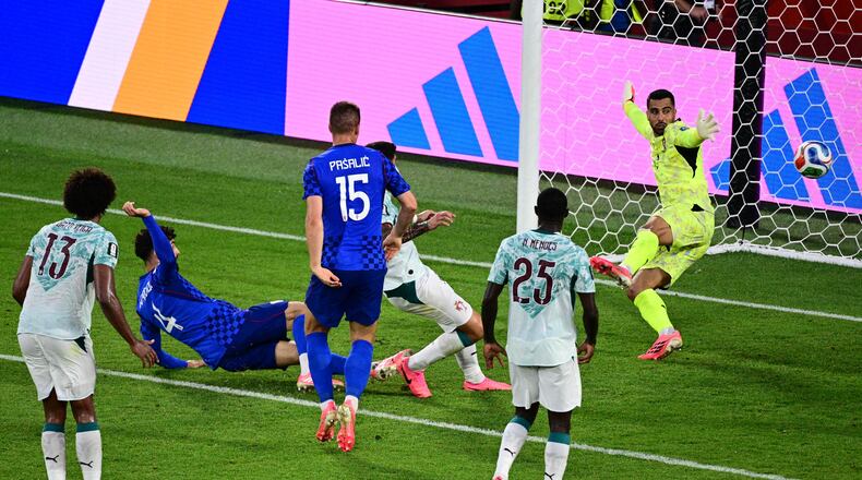 Croatia's Josko Gvardiol (4) scores a goal against Portugal goalkeeper Diego Costa (1) that was later taken back due to an offside call, during the second half of a World Cup round of 32 soccer match, in Toronto on Thursday, July 2, 2026. (Sammy Kogan/The Canadian Press via AP)