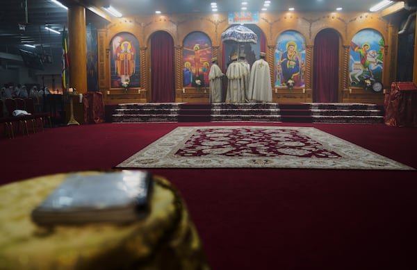 The kesis, or priest, recites the liturgy during service at Re'ese Adbarat Debre Selam Kidist Mariam Church, an Ethiopian Orthodox Tewahedo church, in Washington, D.C., Saturday, April 5, 2025. (AP Photo/Jessie Wardarski)