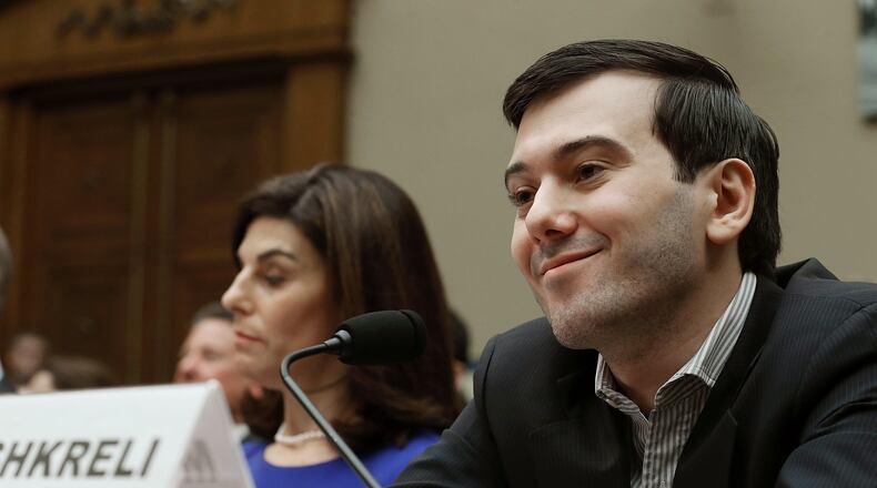 Martin Shkreli, former CEO of Turing Pharmaceuticals, drew notoriety after his company raised the price of the lifesaving drug Daraprim from $13.50 per pill to $750 overnight. He is shown here in Washington during a 2016 House Oversight and Government Reform Committee hearing on the prescription drug market, where he invoked his right under the Fifth Amendment to not testify. He is flanked by Nancy Retzlaff, the chief commercial officer for Turing Pharmaceuticals. (PHOTO by Mark Wilson/Getty Images)