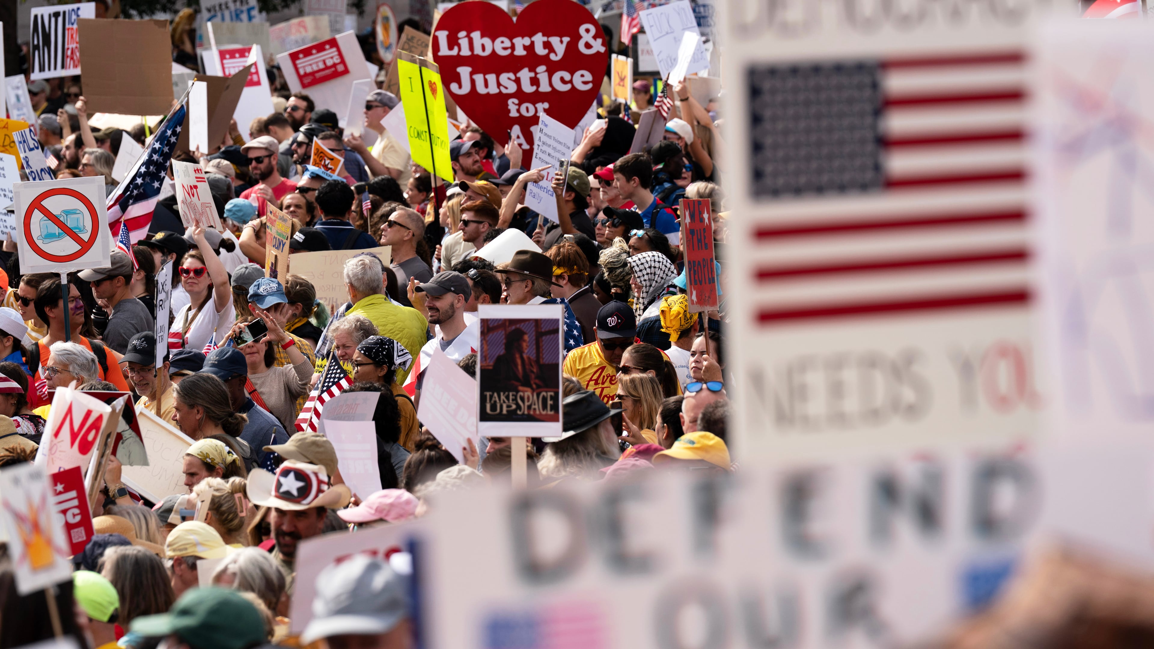 FILE - Demonstrators rally on Pennsylvania Avenue during a No Kings protest in Washington, Oct. 18, 2025. (AP Photo/Jose Luis Magana, File)