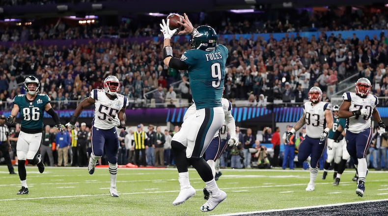 Philadelphia Eagles' Nick Foles catches a touchdown pass during the first half of the NFL Super Bowl 52 football game against the New England Patriots Sunday, Feb. 4, 2018, in Minneapolis. (AP Photo/Jeff Roberson)