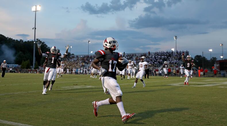 Archer running back Jeremiah Cook (17) scores a touchdown in the first quarter against Mill Creek at Archer High School Friday, September 7, 2018, in Lawrenceville, Ga. (JASON GETZ/SPECIAL TO THE AJC)