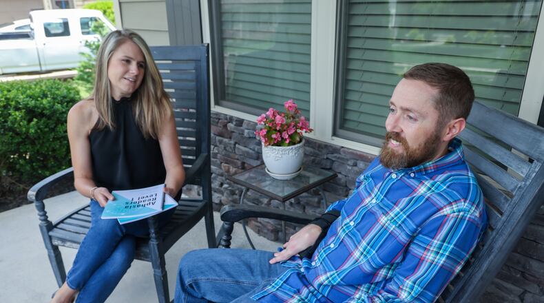 Anna & Ryan Teal on the front porch of their Canton home. Ryan suffered a stroke that left him with Aphasia. He & Anna have developed adult readers to help people with this strengthen their communication skills. PHIL SKINNER FOR THE ATLANTA JOURNAL-CONSTITUTION.