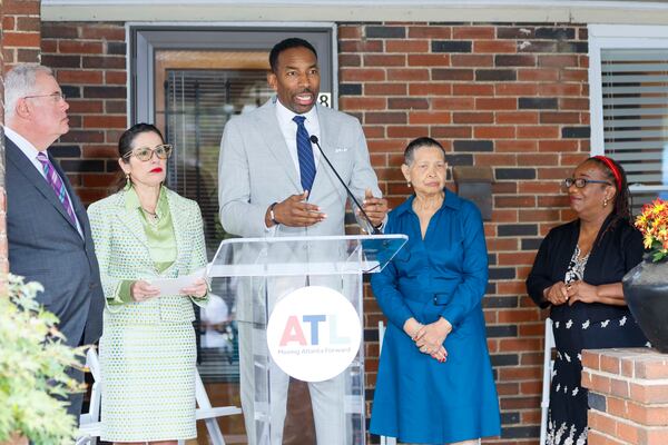 “I also think about this as a son of a senior homeowner: I know the importance of making sure legacy residents across our city can age in place and age with dignity in the homes that they worked so hard for,” Atlanta Mayor Andre Dickens said Monday from the porch of a longtime resident's home. (Miguel Martinez/AJC)