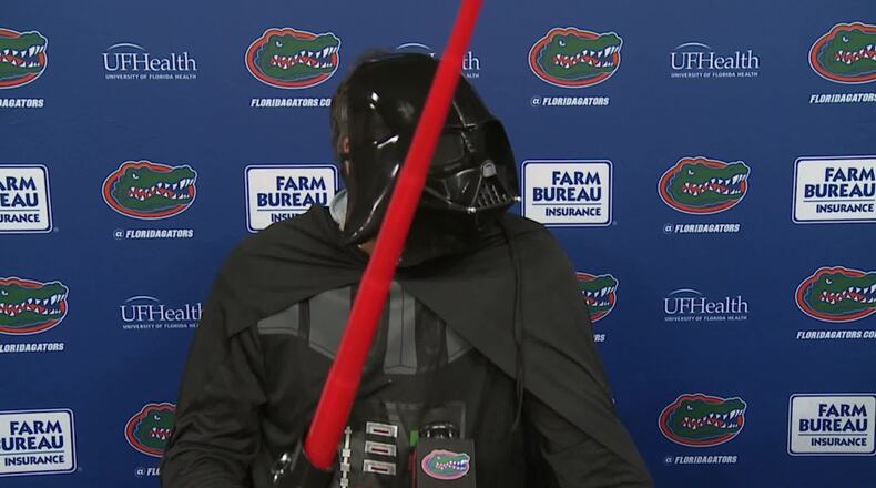 Florida football coach Dan Mullen addresses the media dressed as Darth Vader Saturday, Oct. 31, 2020, in Gainesville, Fla.