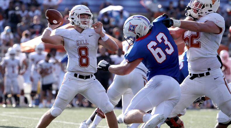 Kell quarterback Corbin LaFrance (8) attempts a pass in the first half against Walton during a 2020 Corky Kell Classic game at Walton High School Friday, Sept. 4, 2020, in Marietta. (Jason Getz/Special to the AJC)
