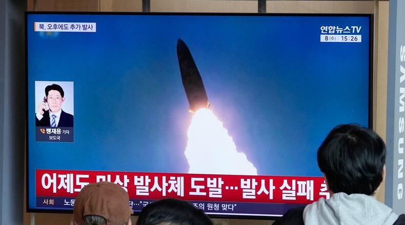 A TV screen shows a file image of North Korea's missile launch during a news program at Seoul Railway Station in Seoul, South Korea, Wednesday, April 8, 2026. (AP Photo/Ahn Young-joon)