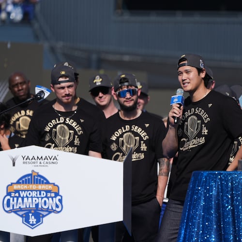 Los Angeles Dodgers' Shohei Ohtani speaks during a celebration of the baseball team's World Series win at Dodger Stadium on Monday, Nov. 3, 2025, in Los Angeles. (AP Photo/Gregory Bull)