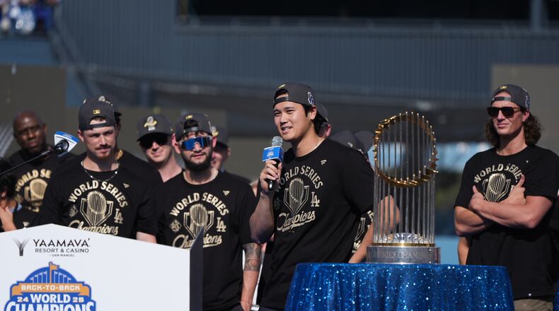 Los Angeles Dodgers' Shohei Ohtani speaks during a celebration of the baseball team's World Series win at Dodger Stadium on Monday, Nov. 3, 2025, in Los Angeles. (AP Photo/Gregory Bull)