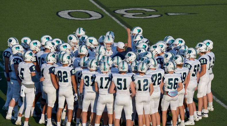 Creekview Grizzlies head coach Trevor Williams (center) rallies his team before the start of their game 2019 against the Allatoona Buccaneers. (Daniel Varnado/Special)