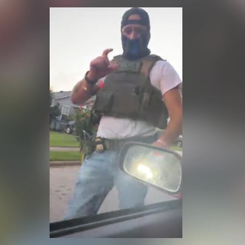 A masked immigration agent asks LaGrange resident Alex Orellana for identification in this screenshot taken from a livestream posted on Facebook on July 7, 2026. (Courtesy of Alex Orellana)
