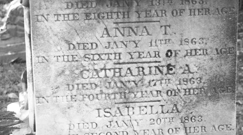 Tombstone at Historic Oakland Cemetery bears the names of four children killed by diphtheria.