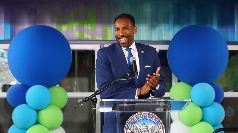 071322 Atlanta: Atlanta Mayor Andre Dickens applaudes the opening of the inaugural BeltLine MarketPlace under the Freedom Parkway Bridge, on Wednesday, July 13, 2022, in Atlanta. The new pilot program offers pop-up storefront space for local, Black-owned businesses in refurbished shipping containers along the Atlanta BeltLine in two different areas. “Curtis Compton / Curtis Compton@ajc.com”