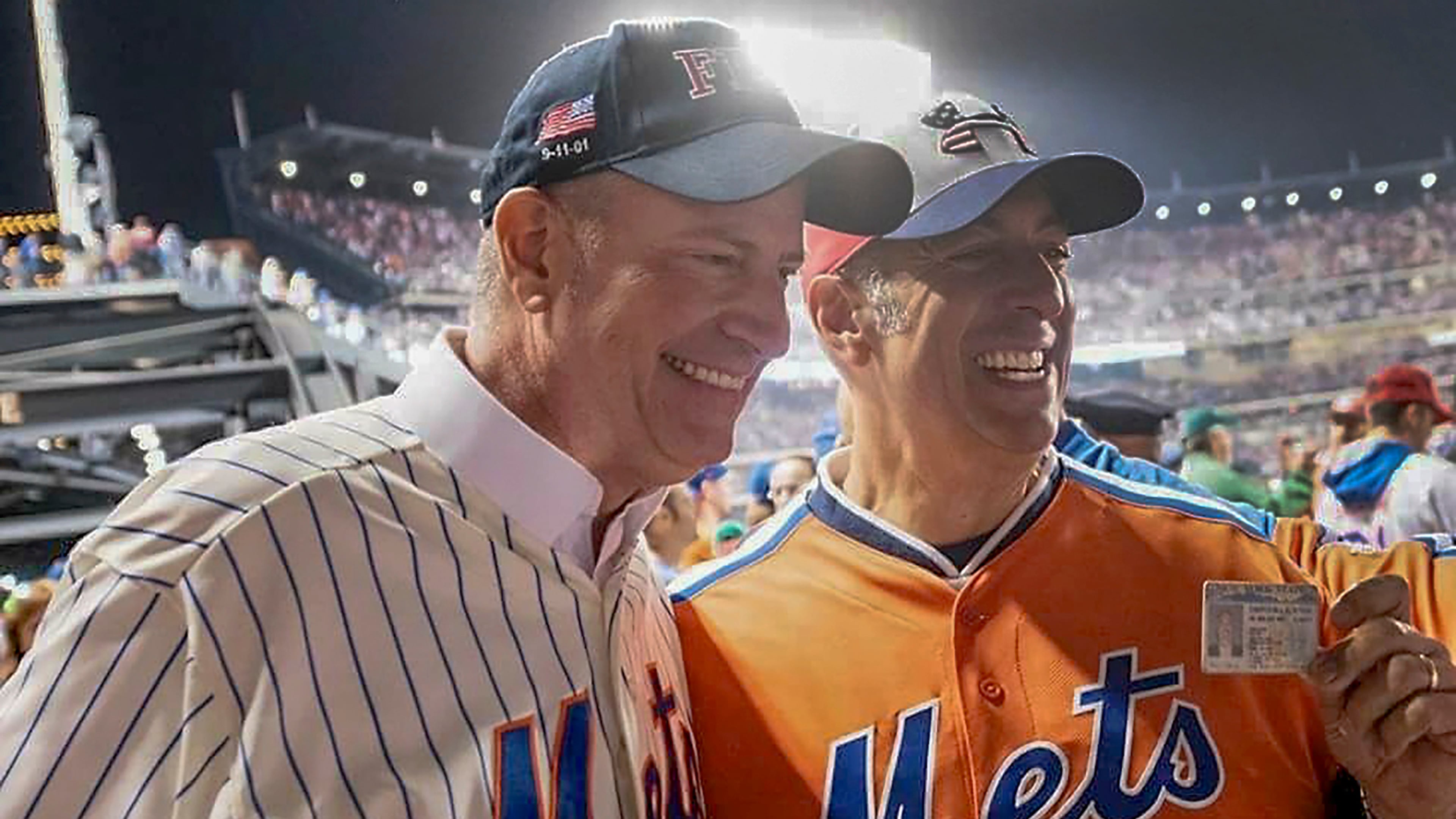 In this undated image, former New York City Mayor Bill de Blasio, left, poses for a photo with Bill DeBlasio, a wine importer from Long Island, at a New York Mets baseball game in New York. (William W. DeBlasio via AP)