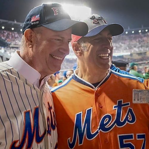 In this undated image, former New York City Mayor Bill de Blasio, left, poses for a photo with Bill DeBlasio, a wine importer from Long Island, at a New York Mets baseball game in New York. (William W. DeBlasio via AP)