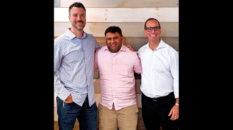 Brett Crowder, VP of operation for DASH Hospitality Group (from left), Sandeep Kothary, owner of The Daily and David Abes, owner of DASH Hospitality Group.