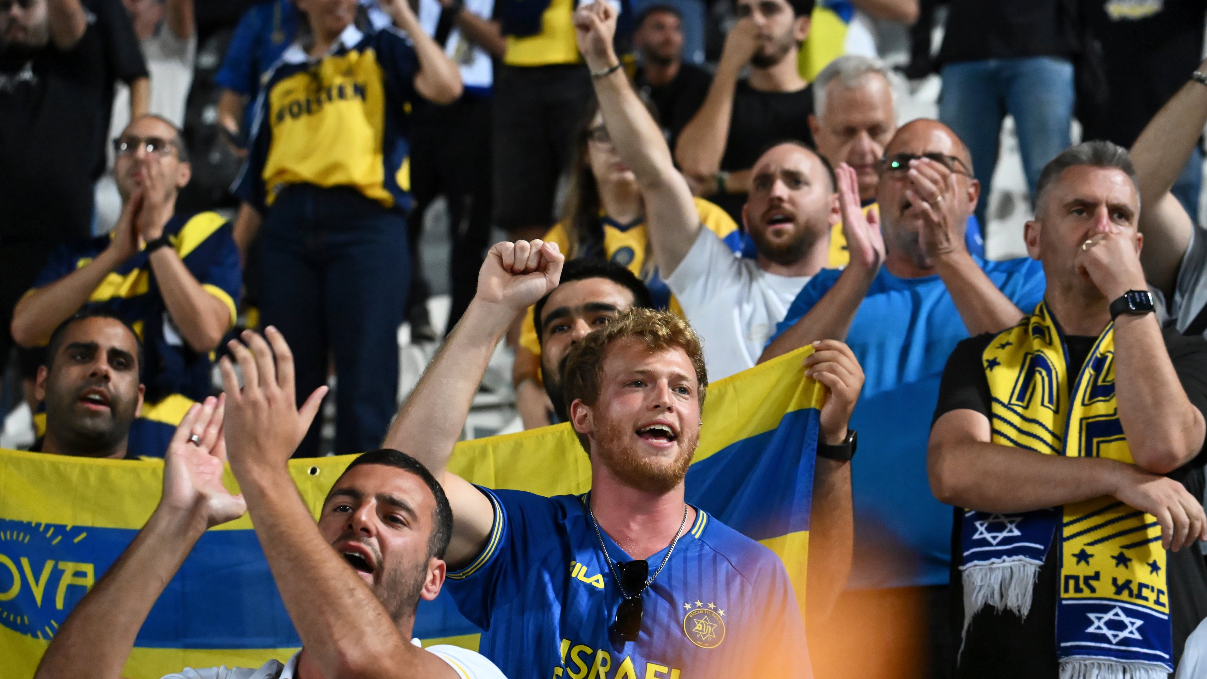 FILE -Maccabi Tel Aviv's fans clap hands after the end of the Europa League soccer match between PAOK and Maccabi Tel Aviv at Toumpa stadium, in Thessaloniki, Greece, Sept. 24, 2025. (AP Photo/Giannis Papanikos, File)