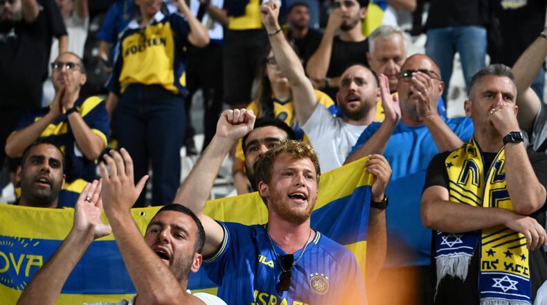 FILE -Maccabi Tel Aviv's fans clap hands after the end of the Europa League soccer match between PAOK and Maccabi Tel Aviv at Toumpa stadium, in Thessaloniki, Greece,  Sept. 24, 2025. (AP Photo/Giannis Papanikos, File)