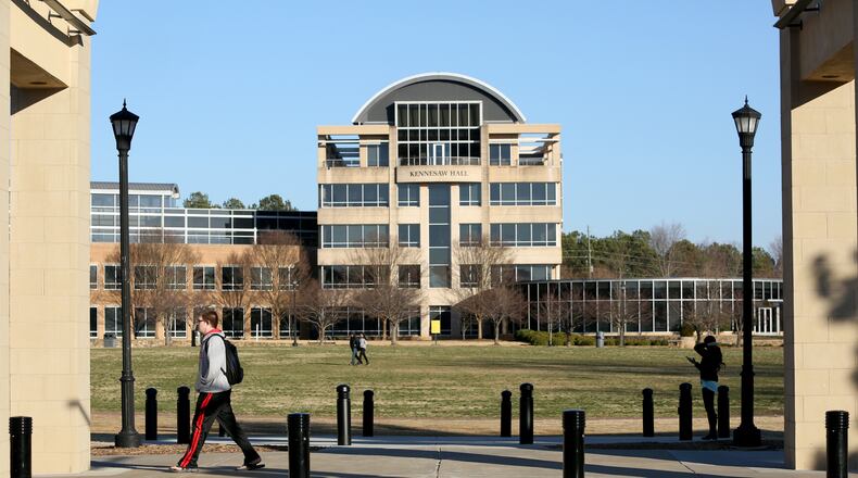 FILE PHOTO: Kennesaw State University students walk on the KSU campus as Kennesaw Hall is shown in the background /JASON GETZ