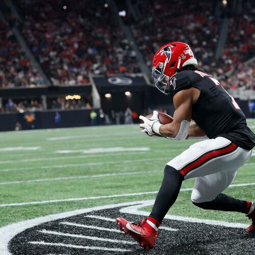 Falcons running back Bijan Robinson catches the ball for a touchdown during the first half against the Los Angeles Rams on Monday, Dec. 29, 2025, at Mercedes-Benz Stadium in Atlanta. (Miguel Martinez/AJC)
