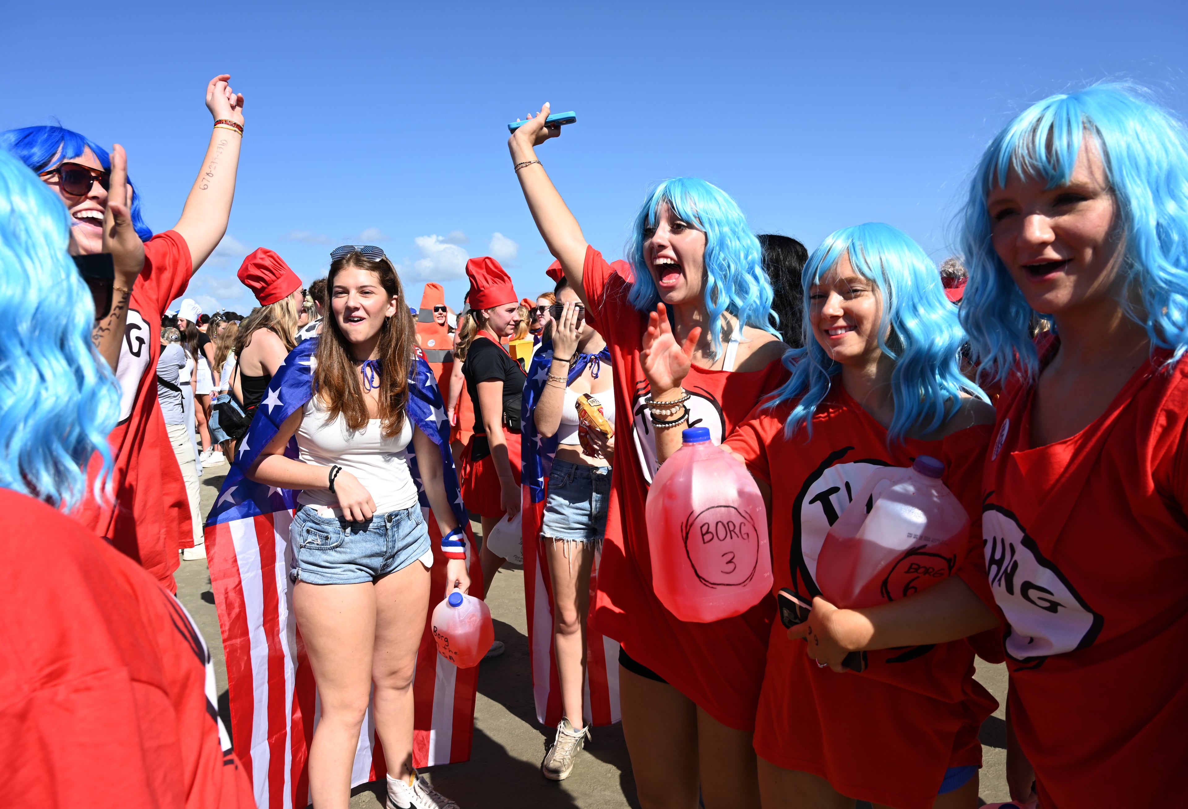 UGA students with Halloween costumes including Natalie Huff (center) enjoy during the annual “Frat Beach” party for the weekend of the Georgia-Florida football game on St. Simons Island, Friday, November 1, 2024. On the weekend of the Georgia-Florida football game, St. Simons Island’s East Beach becomes “Frat Beach,” an open-air party teeming with thousands of college students. (Hyosub Shin / AJC)
