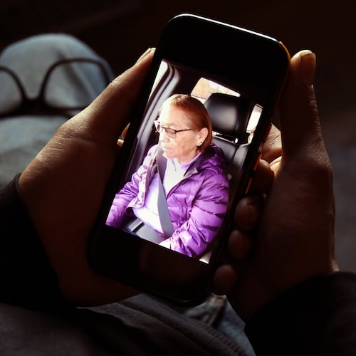 Gerald Begay, whose mother Ella Mae Begay went missing from her home, shows a photo of her on his phone in Denver, Thursday, April 2, 2026. (AP Photo/Thomas Peipert)