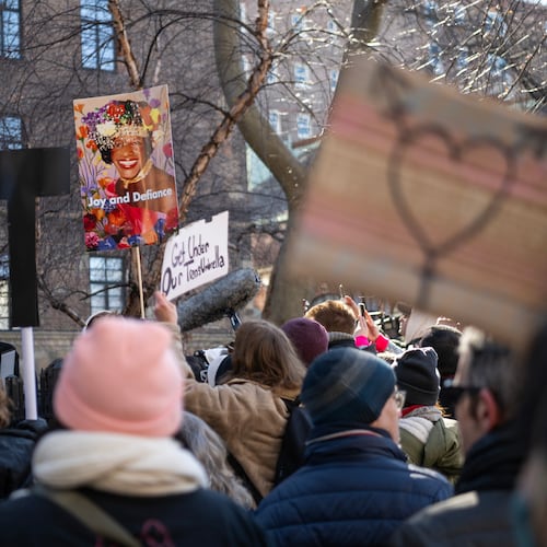 Protesters carry placards of Marsha P. Johnson, a transgender woman whose legacy of activism is memorialized at the Stonewall National Monument in the Greenwich Village neighborhood of New York, Feb. 14, 2025. Hundreds of people gathered at the Greenwich Village site to condemn what they saw as a chilling strike against the symbolic heart of the gay rights movement. (Brittainy Newman/The New York Times)