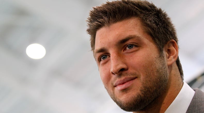 Quarterback Tim Tebow addresses the media as he is introduced as a New York Jet at the Atlantic Health Jets Training Center on March 26, 2012 in Florham Park, New Jersey. (Photo by Mike Stobe/Getty Images)