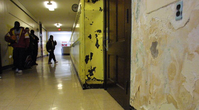 10/29/02 -- 1031arch-p -- Crumbling plaster walls and beat-up lockers are among the signs of deterioration at Kiser Middle School.