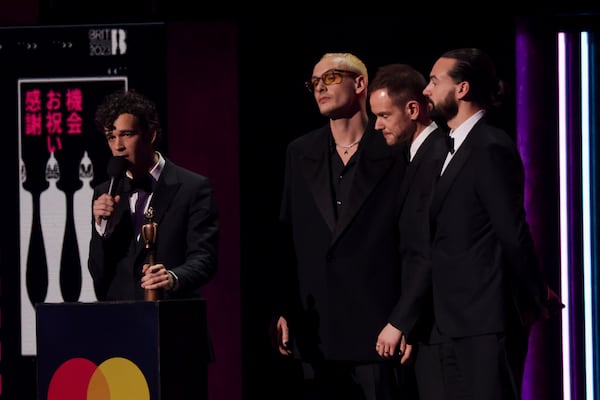 FILE - The 1975 on stage accepting the award for Best Rock/Alternative Act at the Brit Awards 2023 in London, Saturday, Feb. 11, 2023. (Photo by Vianney Le Caer/Invision/AP, file)