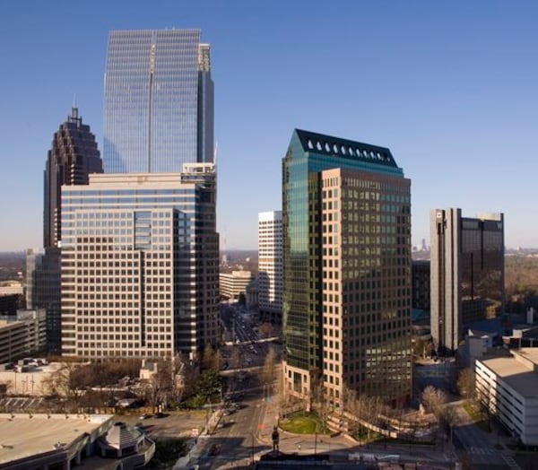 The Campanile building (right center) at 1155 Peachtree St. in Midtown, as seen in 2011, was built in 1987 as BellSouth's headquarters. BellSouth/AT&T moved out in 2007, leaving the tower nearly vacant. Developer John Dewberry bought the building out of distress in 2010 for $36 million. (Stell Simonton for the AJC)
