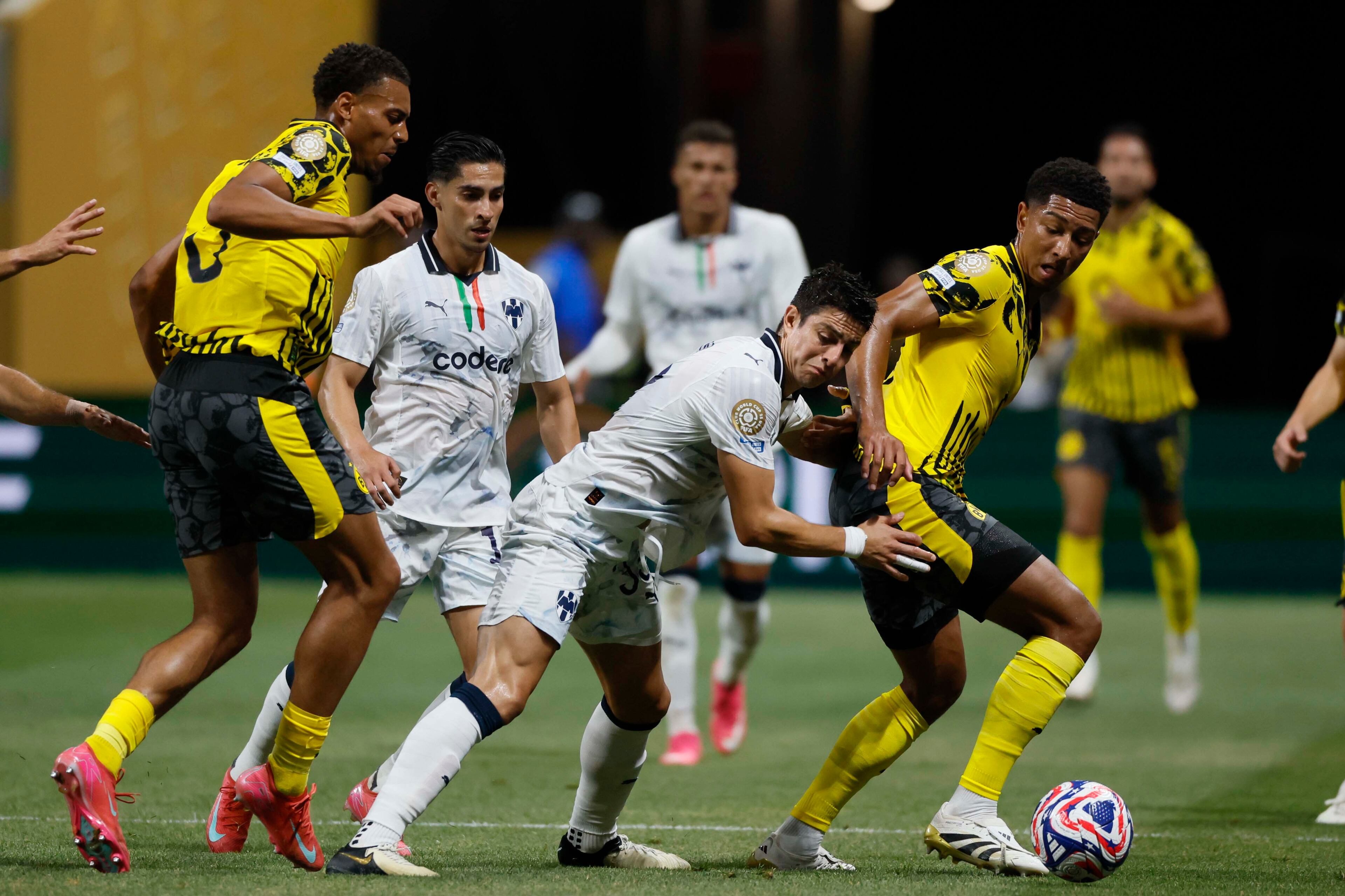 Monterrey defender Stefan Medina (33), center, fights for the ball with Borussia Dortmund forward Serhou Guirassy (9) during the Club World Cup round of 16 soccer match between Borussia Dortmund and C.F. Monterrey in Atlanta, Georgia, on Tuesday, July 1, 2025.
(Miguel Martinez/ AJC)