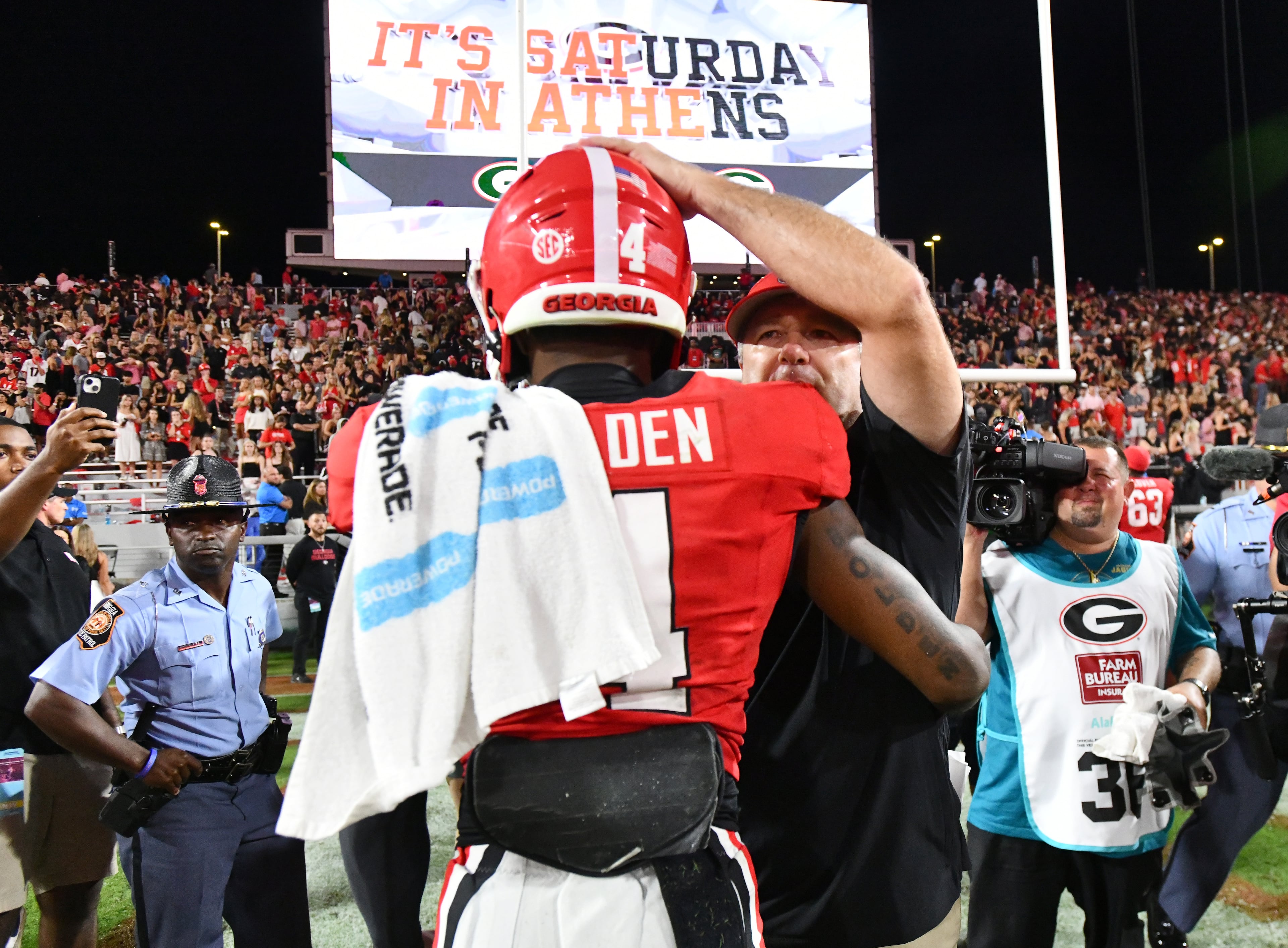 Georgia head coach Kirby Smart comforts Georgia defensive back KJ Bolden (4) after Alabama beat Georgia in an NCAA football game at Sanford Stadium, Saturday, September 27, 2025, in Athens. Alabama won 24-21 over Georgia. (Hyosub Shin / AJC)
