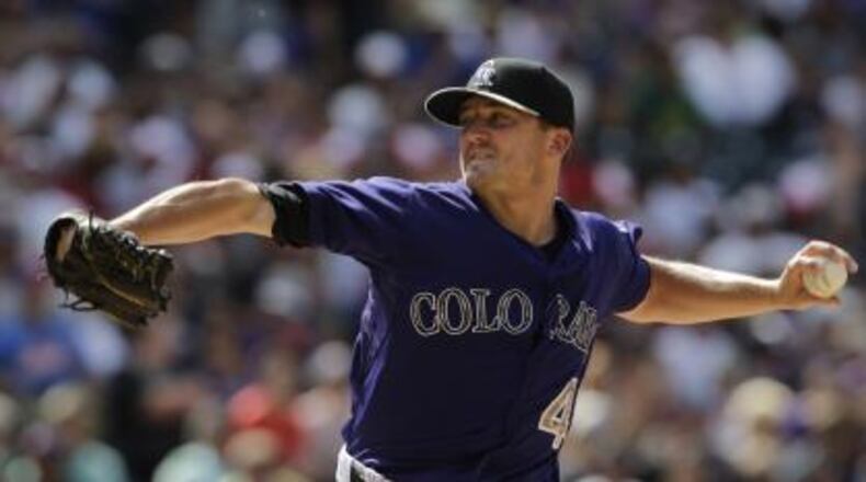Rex Brothers, a dominant reliever for the Rockies in 2013, signed a minor league deal with the Braves on Friday. He’s pictured here in a July 2015 game against the Braves. (AP file photo)