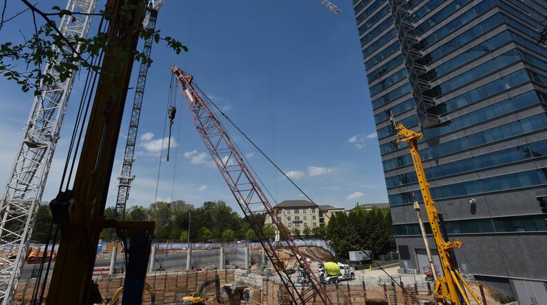 Construction is underway at Three Alliance Center, an office tower being built in Buckhead as vacancy rates drop.