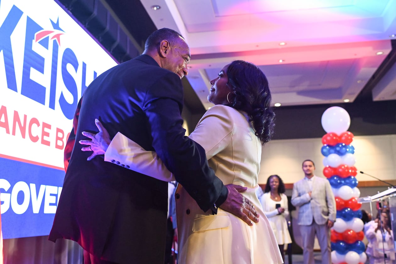 Keisha Lance Bottoms (right), the Democratic nominee for governor in Georgia, hugs her husband, Derek, after winning the primary Tuesday. (Natrice Miller/AJC)