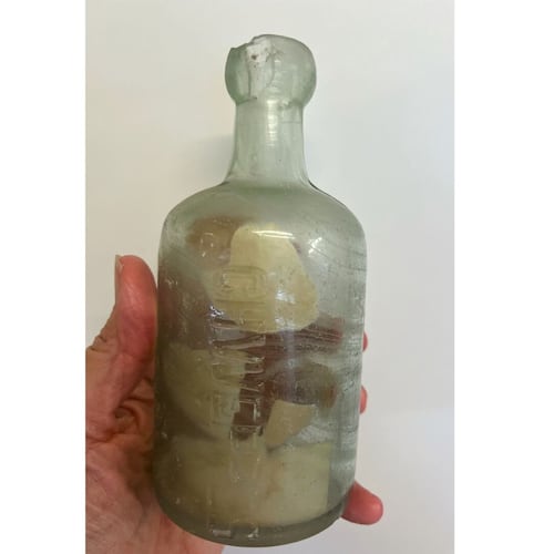 This photo provided by Deb Brown shows a bottle with letters inside in Condingup, Australia, Saturday, Oct. 25, 2025. (Deb Brown via AP)