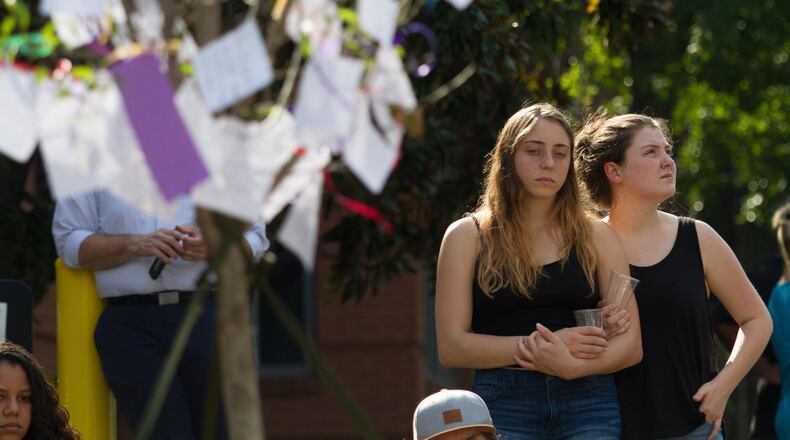 Mourners wrote notes and attached them to a tree at a memorial for Georgia Tech student Scout Schultz Sunday, September 17, 2017, In Atlanta GA. Schultz, an engineering student at Georgia Tech, was shot by Georgia Tech campus police near Curran Parking Deck after allegedly wielding a knife and telling officers to shoot him Saturday night. STEVE SCHAEFER / SPECIAL TO THE AJC