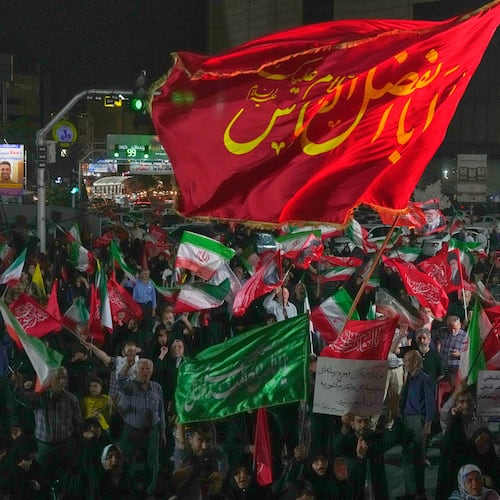 Pro-government demonstrators gather at a square in Tehran, Friday, July 17, 2026. (AP Photo/Vahid Salemi)
