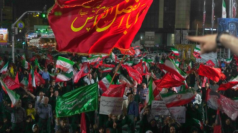 Pro-government demonstrators gather at a square in Tehran, Friday, July 17, 2026. (AP Photo/Vahid Salemi)