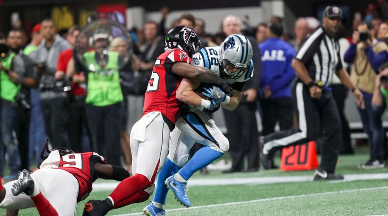 12/31/2017 -- Atlanta, GA, - Carolina Panthers running back Christian McCaffrey (22) is tackled by Atlanta Falcons middle linebacker Deion Jones (45) during the second half of the game at Mercedes Benz Stadium, Sunday, December 31, 2017. The Atlanta Falcons beat the Carolina Panthers, 22-10.  ALYSSA POINTER/ALYSSA.POINTER@AJC.COM
